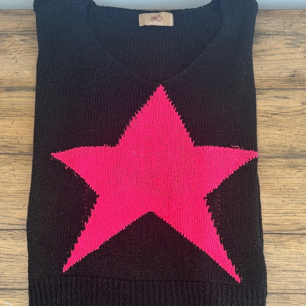 Trendy Black V-Neck Sweater with Pink Star
